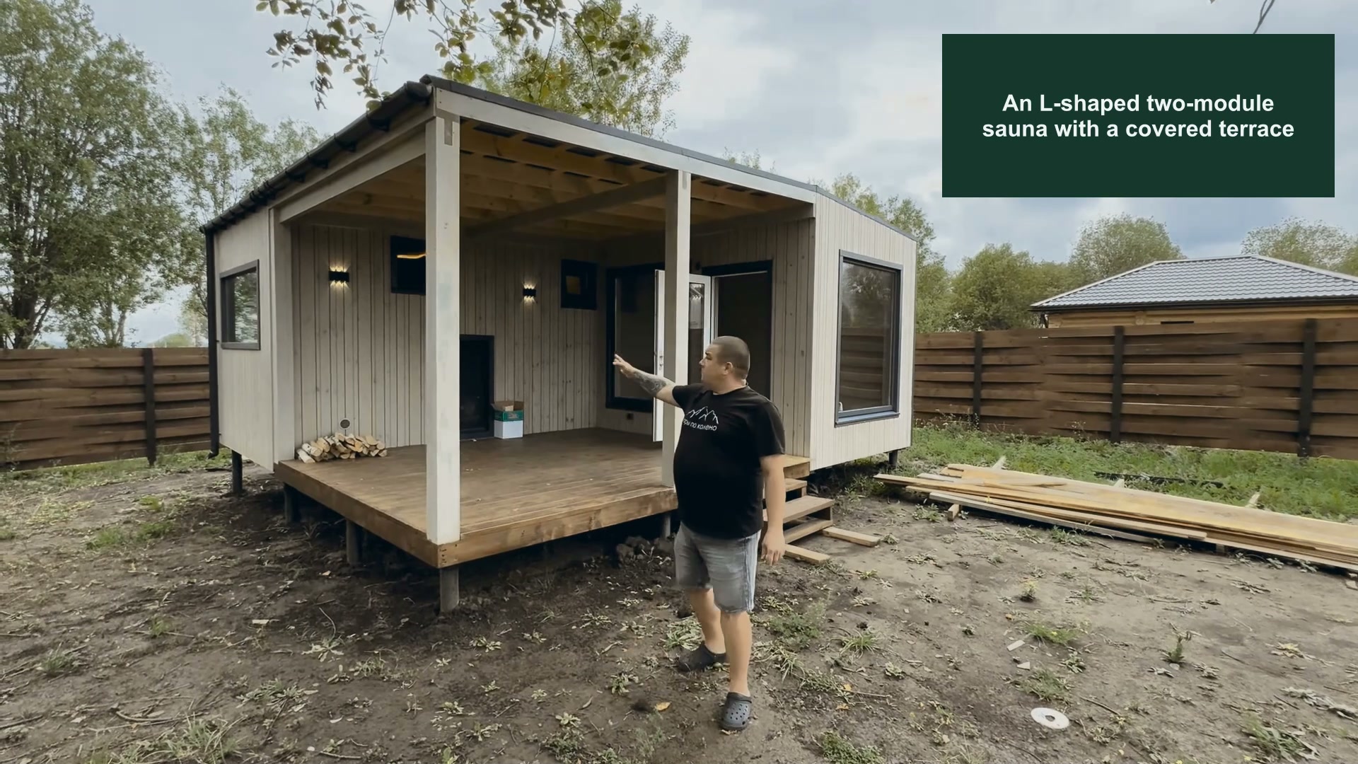 An L-shaped two-module sauna with a covered terrace